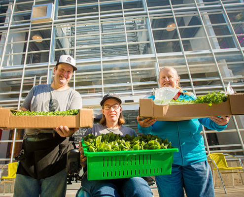 Employees in front of Greenhouse 1