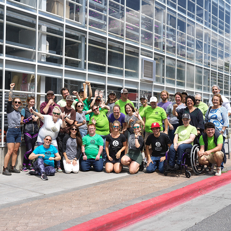 Diverse group of employees working in a Competitive Integrated Employment organization outside of their Jackson Hole farm
