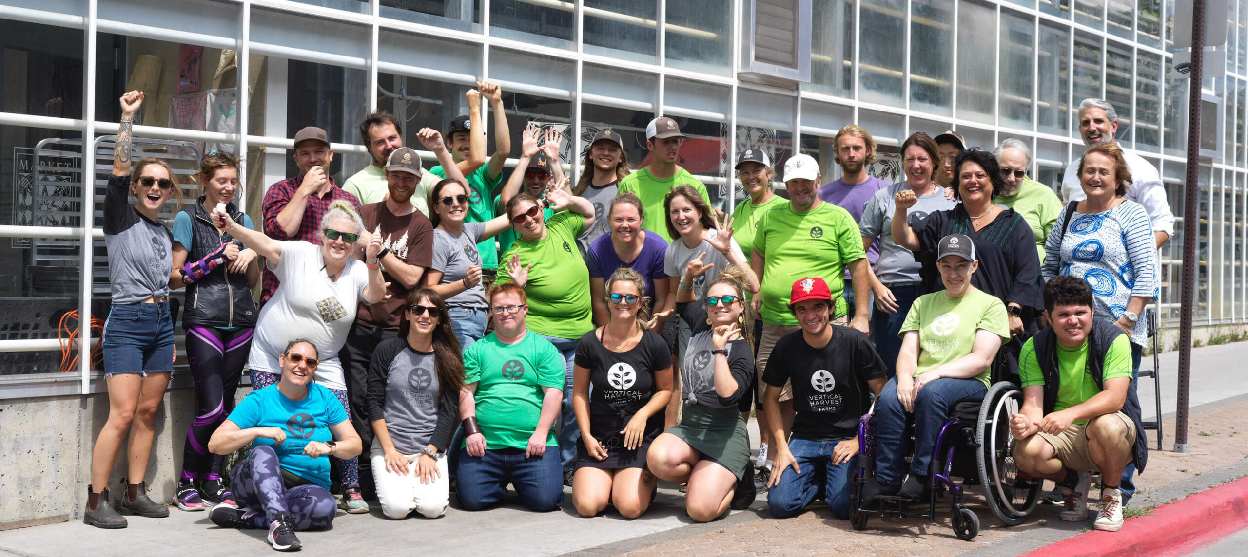 Diverse group of employees working in a Competitive Integrated Employment organization outside of their Jackson Hole farm